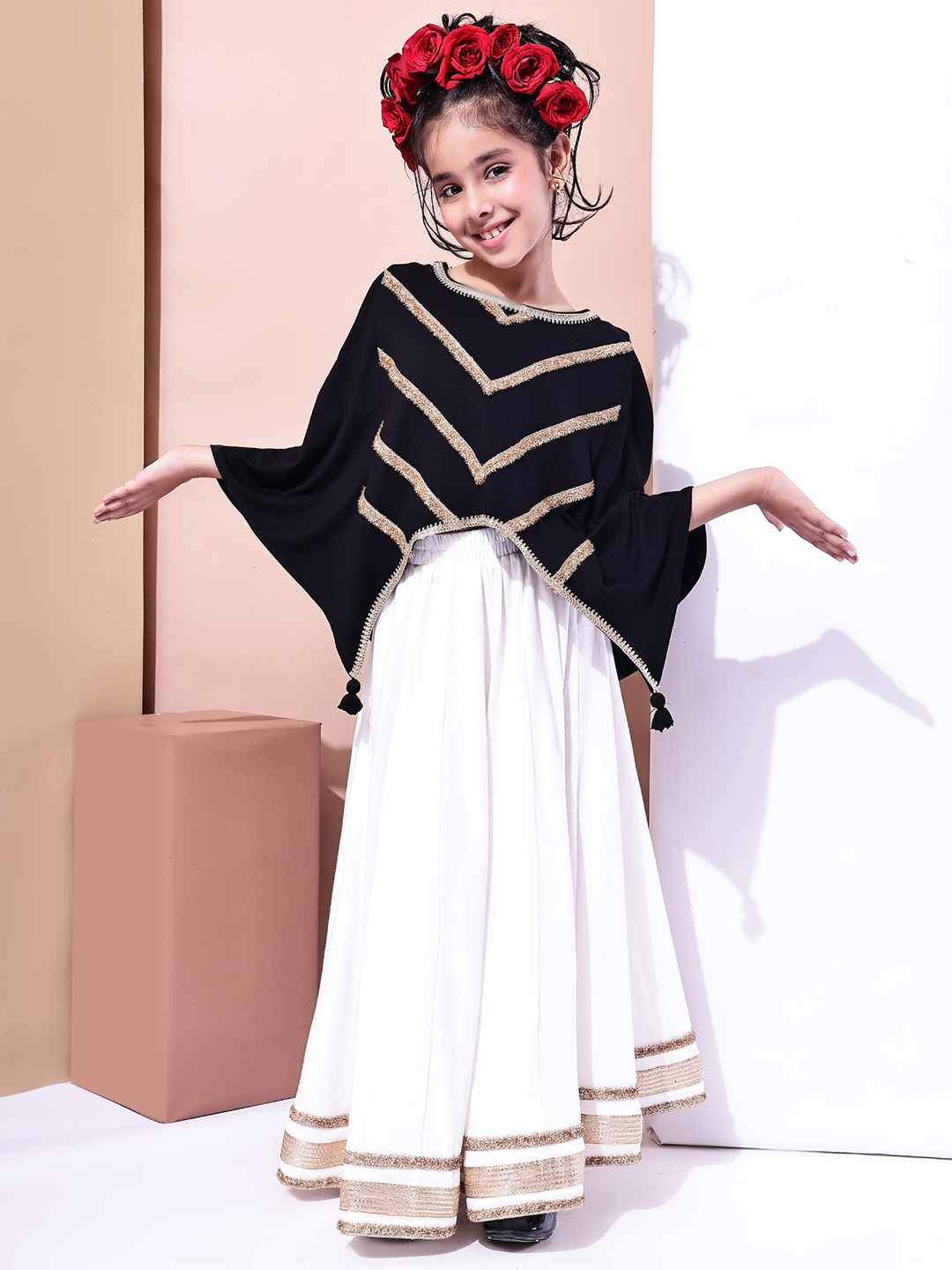 BaawRi Girls Black Cape-Style Top with Inner & Off White Cotton Flared Lehenga with Golden Detailing